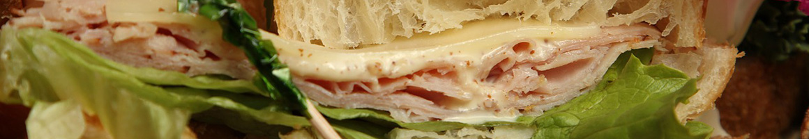 Eating Italian Pizza Sandwich at Bellacino's Pizza & Grinders restaurant in Grundy, VA.